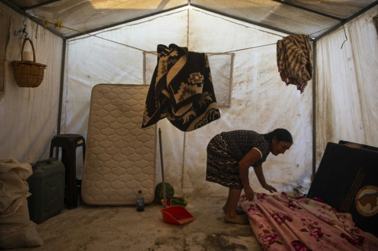 At the San Pablo refuge, residents draw water from wells for drinking and watering small vegetable patches in a place where day temperatures reach 35 degrees Celsius (95 Fahrenheit)
