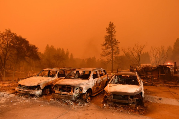 Abandoned and burned-out vehicles sit at a car lot in Paradise, California on November 9, 2018