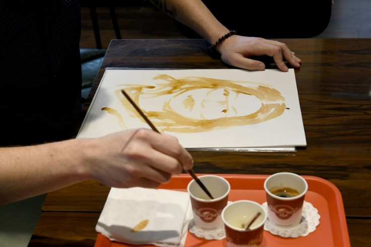 Kryemadhi uses coffee like watercolour paints, composing portraits with a rich, brown patina -- adding water to create different shadesÂ