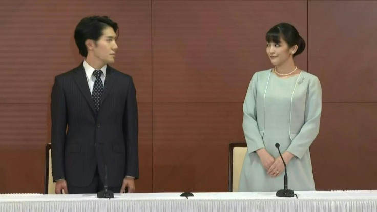 IMAGES Images of Japan's Princess Mako and her husband Kei Komuro meeting the media after their wedding on Tuesday.