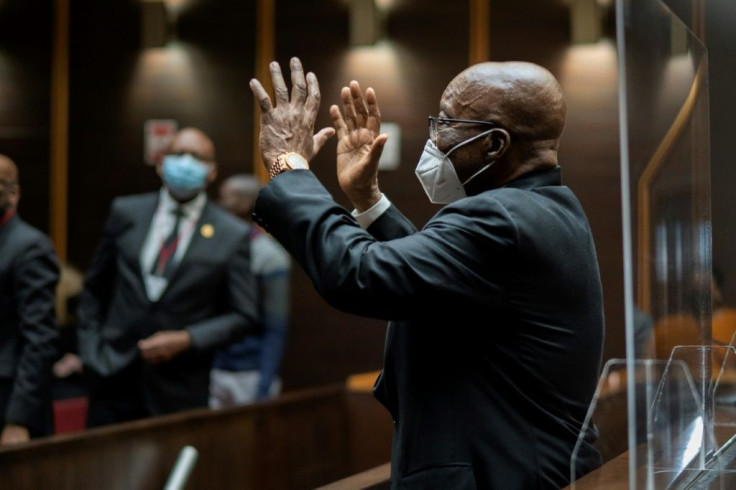 Zuma waved to supporters at Tuesday's hearing