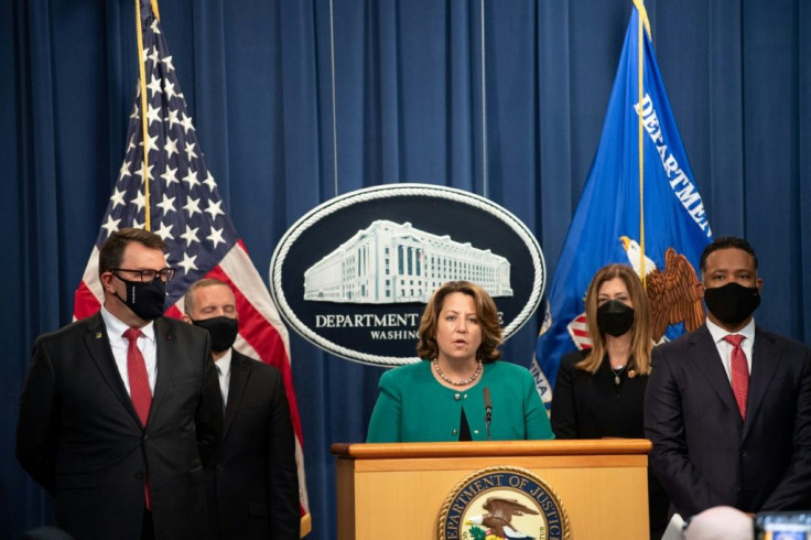 US Deputy Attorney General Lisa Monaco (C), with Europol Deputy Executive Director Jean-Philippe Lecouffe (L), speaks about Operation Dark HunTor, a joint criminal opioid and darknet enforcement operation