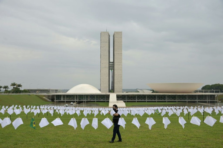 White scarves representing people who died of Covid-19 were installed in front of Brazil's National Congress