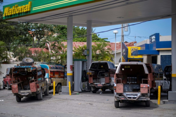 Vehicles lined up at a closed gas station in Port-au-Prince, Haiti