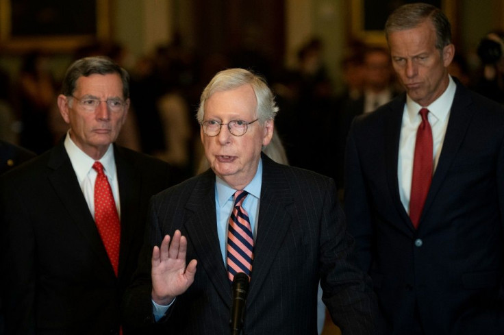 US Senate Minority Leader Mitch McConnell (center) blamed pandemic aid programs for fueling inflation