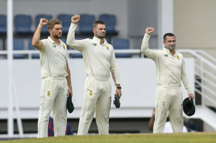 Standing not kneeling: South Africa's Wiaan Mulder, Aiden Markram and Dean Elgar raise their fists before the first Test against the West Indies in St Lucia in June