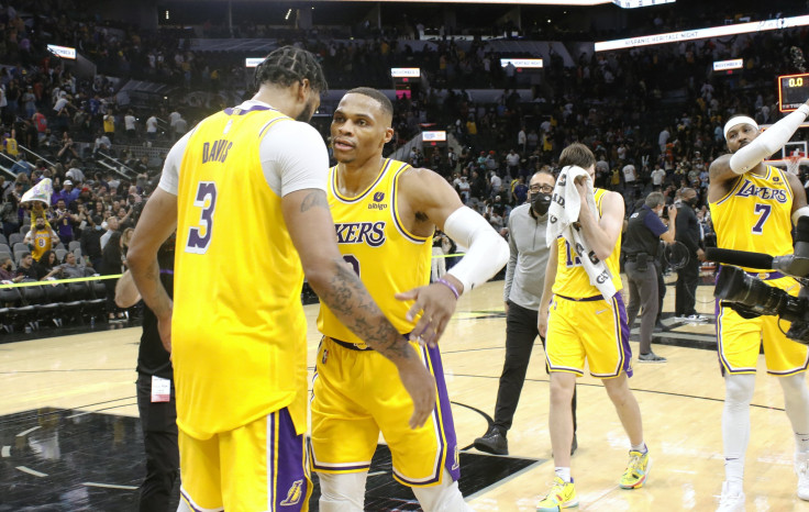 Russell Westbrook #0 of the Los Angeles Lakers hugs teammate Anthony Davis #3 