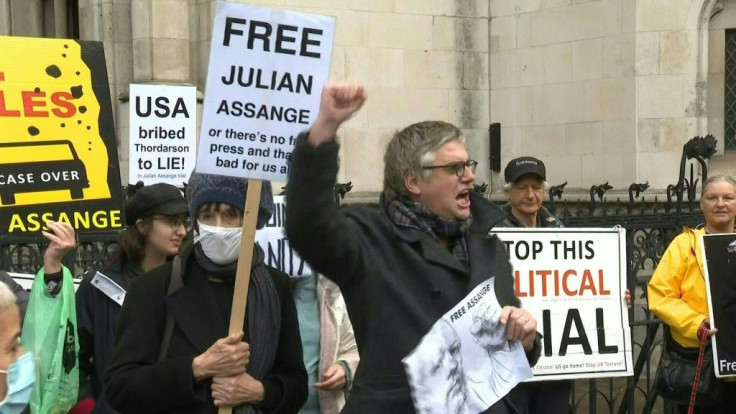 IMAGESJulian Assange supporters gather in front of the Royal Courts of Justice in London as the US government will appeal against a British judge's decision to block the extradition of the WikiLeaks founder to face trial for publishing military secrets.