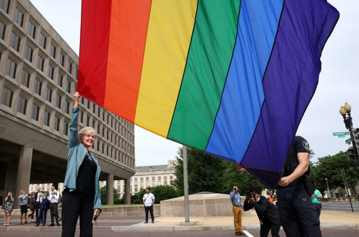 Energy Secretary Jennifer Granholm raises the Progress Pride Flag for the first time outside the Department of Energy on June 2, 2021