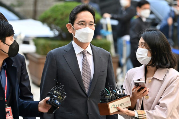 The earnings report comes a day after Samsung scion Lee Jae-yong (C) was convicted of illegally using the anaesthetic propofol and ordered to pay 70 million won in fines
