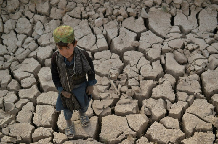 A child stands on a dry land in Bala Murghab district of Badghis province. Drought stalks the parched fields around the remote Afghan district of Bala Murghab, where climate change is proving a deadlier foe than the country's recent conflicts