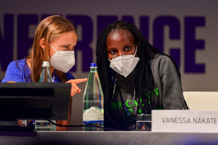Swedish climate activist Greta Thunberg, seen here with Ugandan climate activist Vanessa Nakate in Milan last month, has confirmed she will go to Glasgow