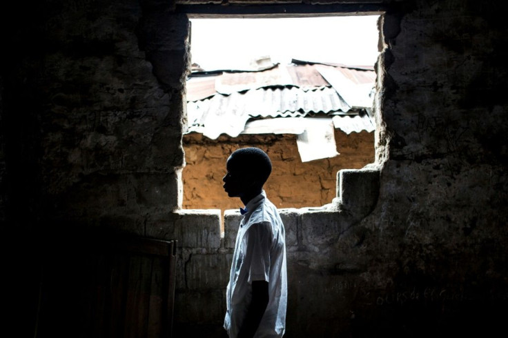 A former child soldier studies at a reintegration facility
