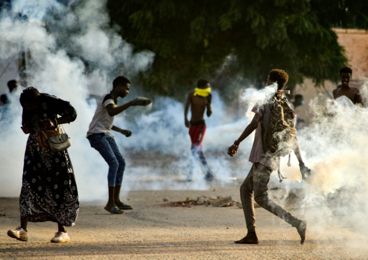 Sudanese youths confront security forces amid demonstrations against a military takeover this week