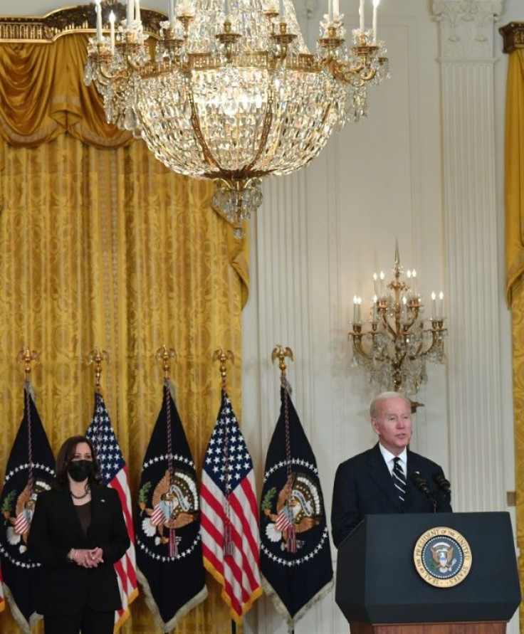 US President Joe Biden speaks about his administration's social spending plans, as US Vice President Kamala Harris look on