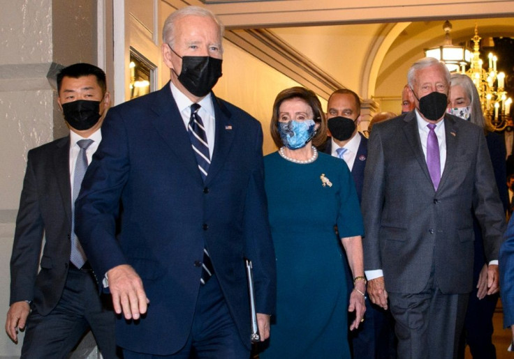 US President Joe Biden, followed by Speaker of the House Nancy Pelosi (C) and House Majority Leader Steny Hoyer (R), arrives at the US Capitol in Washington, DC, on October 28, 2021