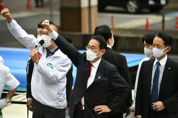 Japan's Prime Minister Fumio Kishida (C) is widely expected to win Sunday's election -- but young voters are uninspired