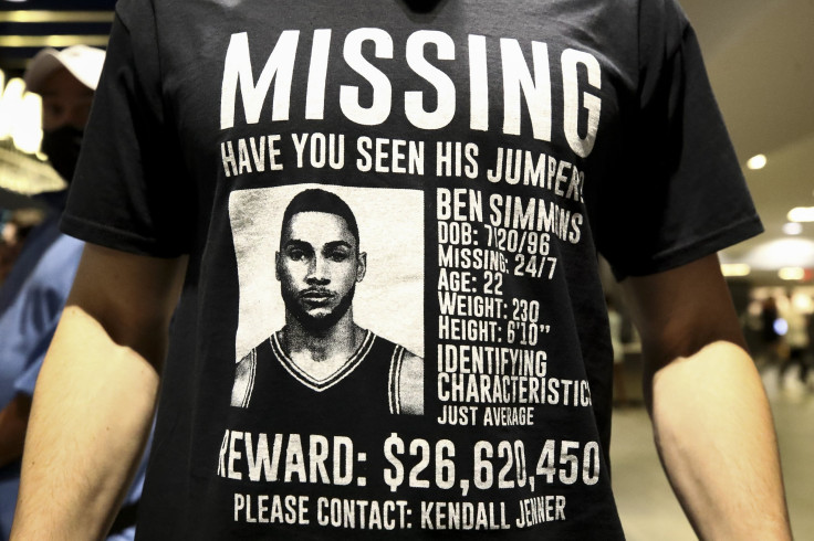 A spectator displays a T-shirt during a game between the Philadelphia 76ers and the Brooklyn Nets at Wells Fargo Center