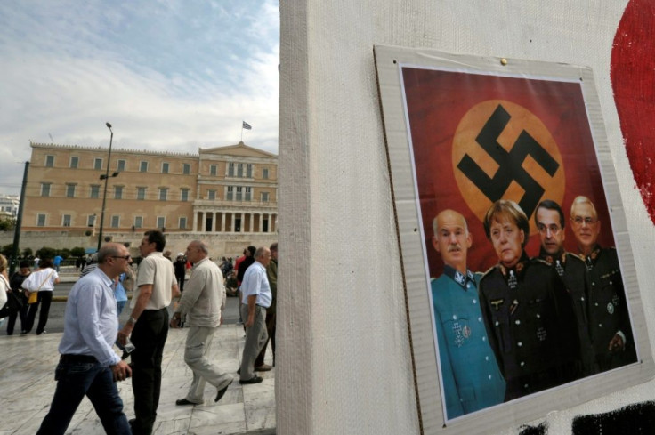 At the height of the crisis in 2012, Merkel faced protesters brandishing banners with Nazi swastikas and depictions of her as a Hitler caricature