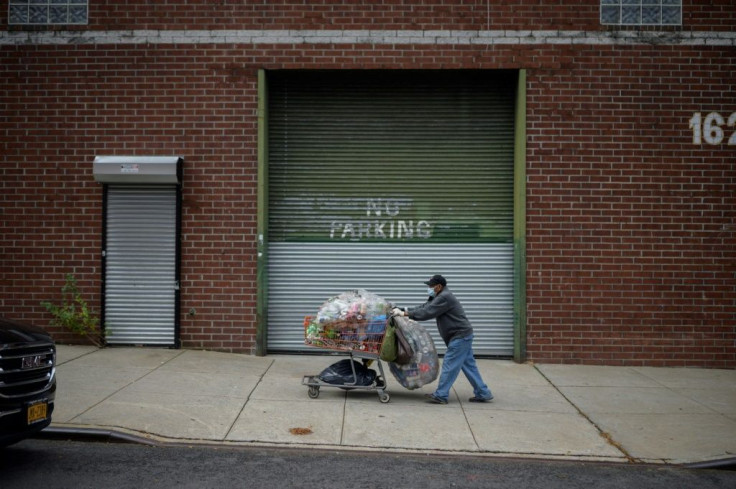 Eighty-year-old Mexican Laurentino Marin, drives his trolley of recycling through the streets of Brooklyn in New York on October 27, 2021