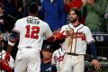 Atlanta's Dansby Swanson, right, congratulates teammate Jorge Soler, left, after both hit home runs in the seventh inning to lift the Braves over Houston on Saturday in game four of the World Series