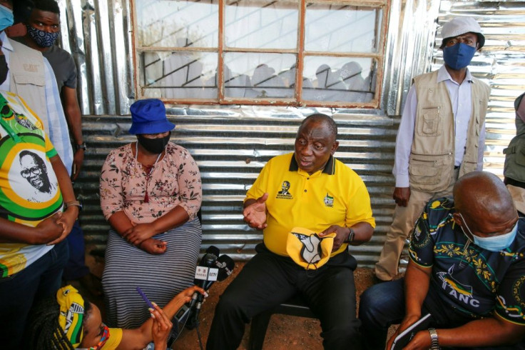 On the stump: President Cyril Ramaphosa speaks to a woman at her home in Ga-Rankuwa township near Pretoria