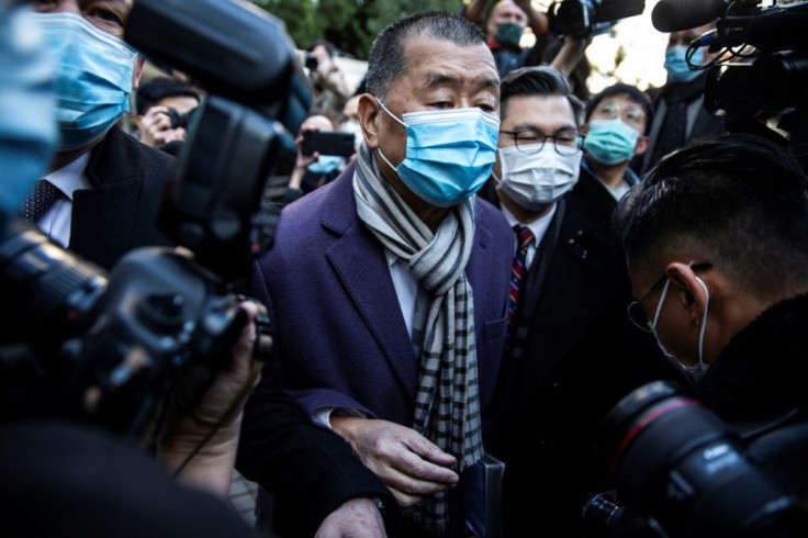 Hong Kong media tycoon Jimmy Lai (C) is facing several charges over his pro-democracy activism and role in the 2019 protests