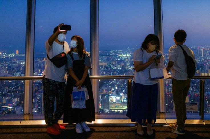 Daily virus cases in Japan have plummeted from record highs in August