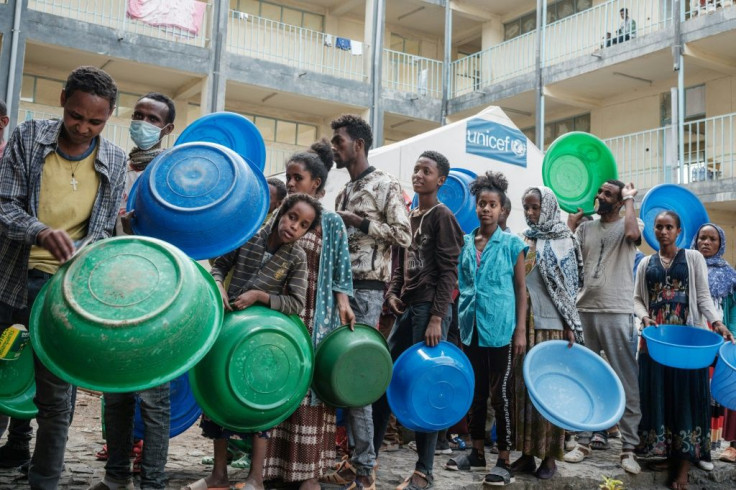 Lining up for food aid in Tigray's capital Mekele: The conflict has pushed an estimated 400,000 people to the brink of famine, with Tigray under a de facto aid blockade, according to the UN