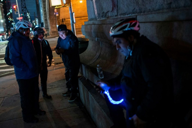 Every night, groups of "deliveristas" meet under a Manhattan bridge where they stand ready to come to the aid of any colleague in trouble