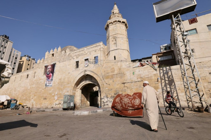 Barbakh walks in front of Khan Yunis's 13th Century Barquq Castle where he said dozens of bodies killed by Israeli troops were left outside the walls