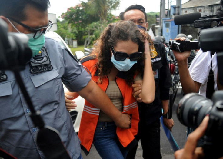 Heather Mack is escorted Friday by immigration guards in Jimbaran on the resort island of Bali