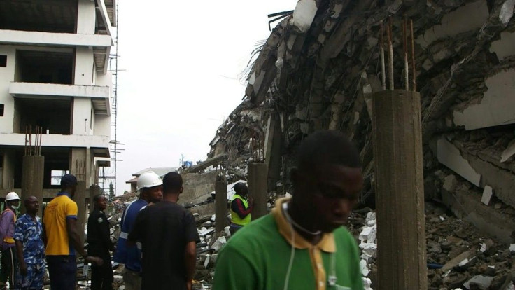 IMAGES Rescue workers stand near the rubble of the high-rise building that collapsed in the Nigerian economic hub Lagos hoping to hear the voices of the dozens feared trapped.