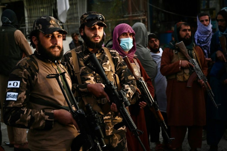 Taliban fighters stand guard near the Sardar Mohammad Dawood Khan military hospital in Kabul on November 2, 2021, after at least 19 people were killed and 50 others wounded in an attack on a military hospital