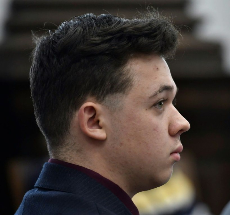 Kyle Rittenhouse listens as Assistant District Attorney Thomas Binger gives an opening statement to the jury during his trial at the Kenosha County Courthouse  in Kenosha, Wisconsin.