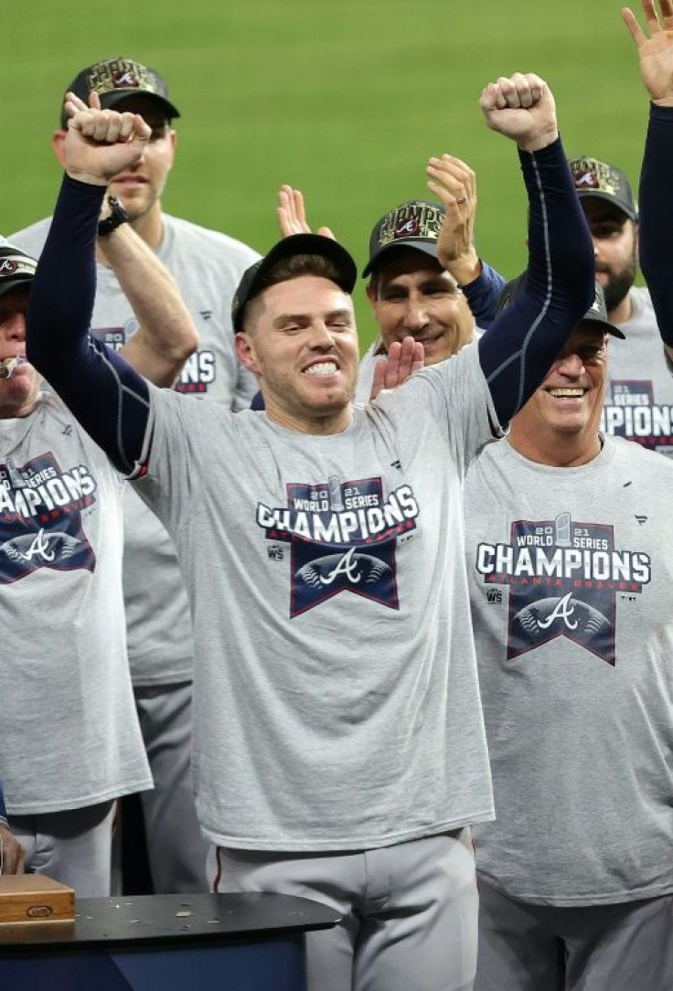 Atlanta Braves first baseman Freddie Freeman celebrates with teammates after their 7-0 win over the Houston Astros to win the 2021 World Series