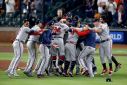 The Atlanta Braves celebrate after clinching victory over the Houston Astros to win the World Series on Tuesday