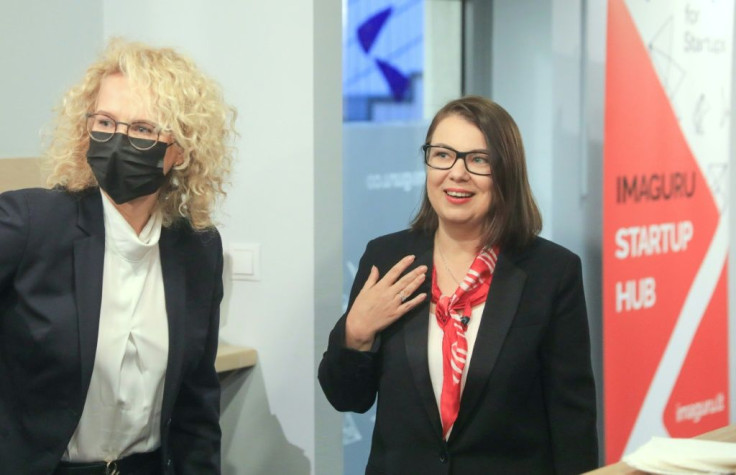 Lithuanian Economy Minister Ausrine Armonaite (L) invited Imaguru chief executive Tania Marinich to Vilnius