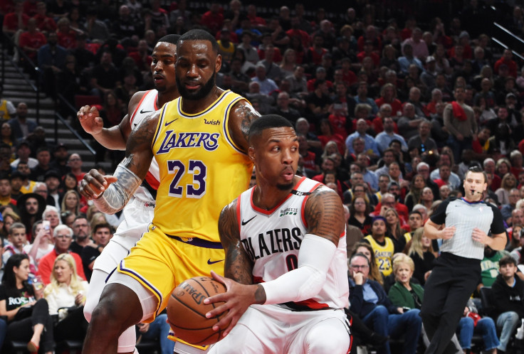  Damian Lillard #0 of the Portland Trail Blazers steals from LeBron James #23 of the Los Angeles Lakers