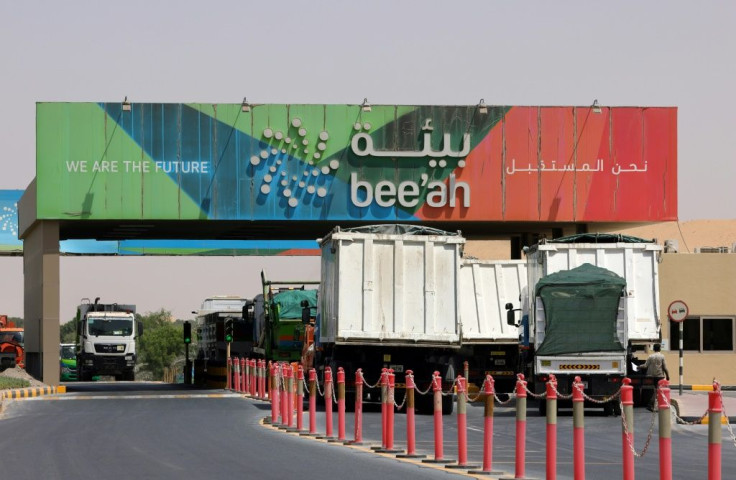 Trucks drive into the Bee'ah waste management site in the Gulf emirate of Sharjah; as the UAE has grown waste production has multiplied