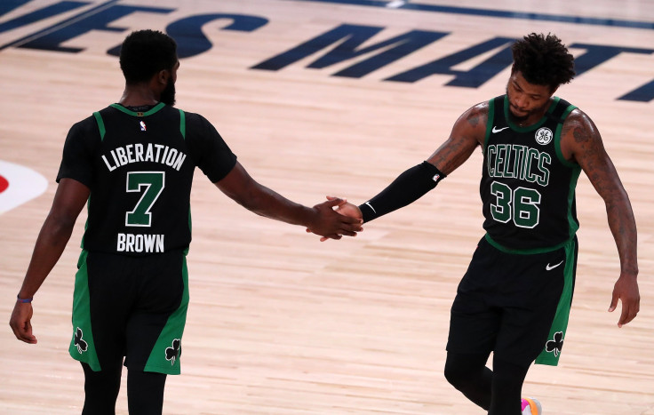 Jaylen Brown #7 of the Boston Celtics and Marcus Smart #36 of the Boston Celtics
