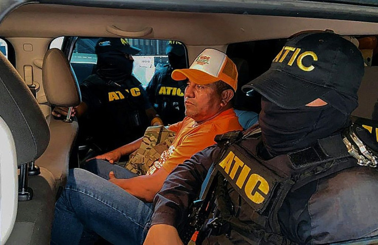 Presidential candidate Santos Rodriguez is escorted by Honduran authorities following his arrest over money laundering