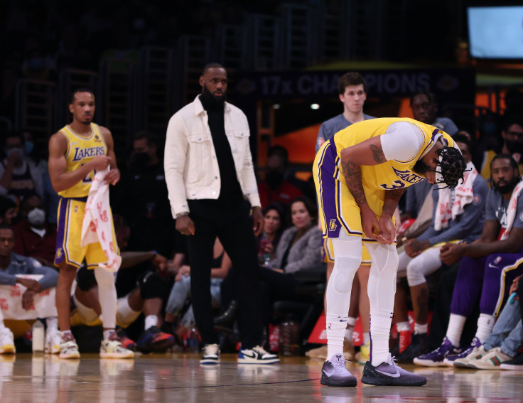 Anthony Davis of the Los Angeles Lakers reacts after an injury in front of LeBron James