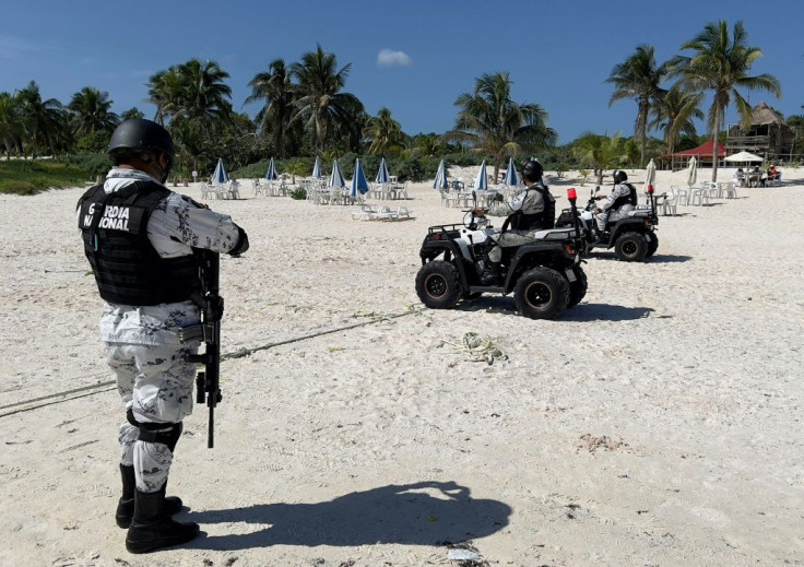 Troops patrol the beach in Tulum, a once sleepy Mexican Caribbean resort where two tourists were killed in gang crossfire in October 2021