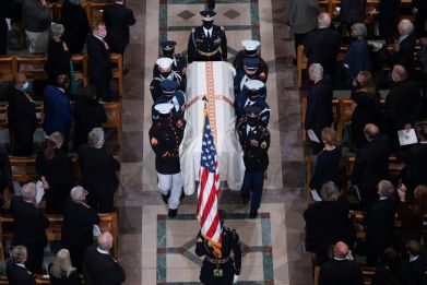 Members of the military honor guard carry the casket during the funeral service of former US secretary of state Colin Powell at the Washington National Cathedral