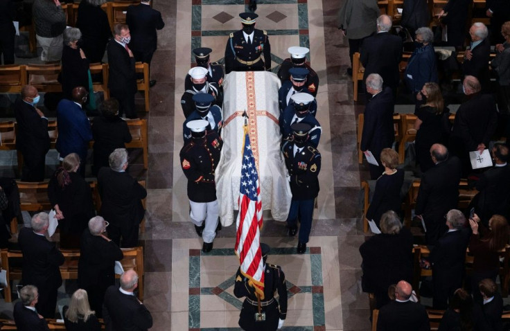 Members of the military honor guard carry the casket during the funeral service of former US secretary of state Colin Powell at the Washington National Cathedral