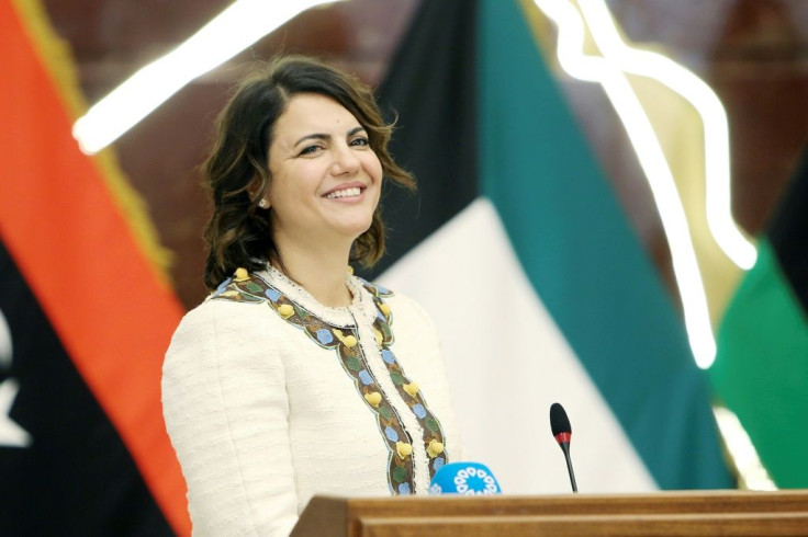 Libyan Foreign Minister Najla al-Mangoush, seen here addressing a news conference in Kuwait last month, has been barred from travel pending the results of an investigation