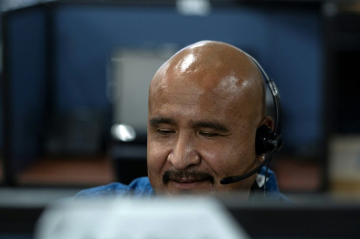 After being deported from the United States, Martin Figueroa works at a call center in the Mexican border city of Tijuana
