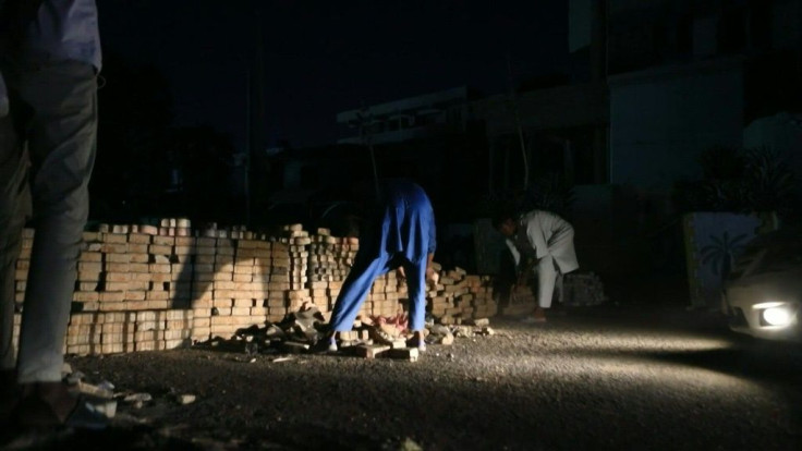 Pro-democracy protesters build barricades in the streets of Khartoum as they prepare to launch two more days of civil disobedience against Sudan's military coup.
