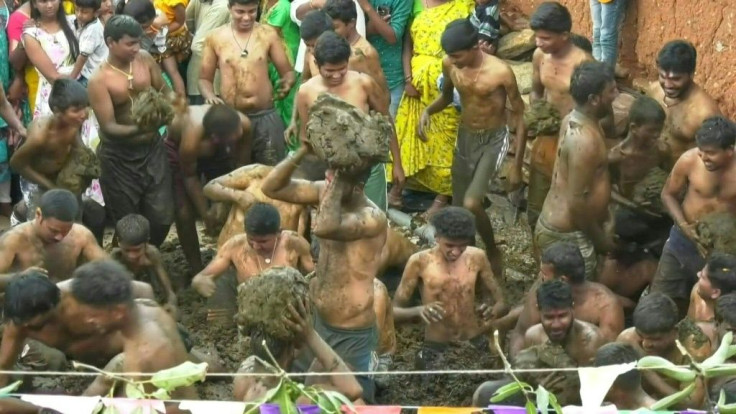 Joyful crowds pelt each other with fistfuls of cow manure as part of one village's local ritual to mark the end of Diwali, India's most important Hindu festival